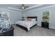 Calming bedroom with tray ceiling, dual windows, neutral tones, and plush carpeting for ultimate relaxation at 96 Northwood Dr, Fuquay Varina, NC 27526