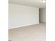 Spacious bonus room showcasing neutral carpet, light gray walls and trim at 96 Northwood Dr, Fuquay Varina, NC 27526