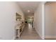 Bright entryway with a modern table, mirror, and sleek wood floors leading to the living area at 96 Northwood Dr, Fuquay Varina, NC 27526