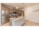 Bright kitchen with stainless steel appliances, granite countertops, and a central island perfect for gatherings at 96 Northwood Dr, Fuquay Varina, NC 27526