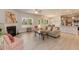 Open-concept living room with fireplace, hardwood floors, and seamless access to the kitchen and dining area at 96 Northwood Dr, Fuquay Varina, NC 27526