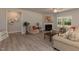 Inviting living room featuring a cozy fireplace, stylish furnishings, and ample natural light at 96 Northwood Dr, Fuquay Varina, NC 27526