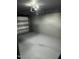 Spacious one-car garage with sealed concrete floors and painted brick walls at 104 Woodcrest Dr, Chapel Hill, NC 27516