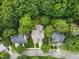 An overhead shot showing the home's location surrounded by lush trees at 10415 Ashmead Ln, Raleigh, NC 27614