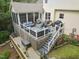 Aerial view of deck, screened porch, landscaping and fenced backyard for outdoor enjoyment at 10415 Ashmead Ln, Raleigh, NC 27614
