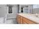 Bathroom featuring double sinks and glass shower at 10415 Ashmead Ln, Raleigh, NC 27614