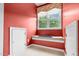 A window seat with a window, window covering, storage and carpet create a cozy space at 10415 Ashmead Ln, Raleigh, NC 27614