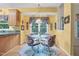 Sunny eat-in kitchen with view to backyard at 10415 Ashmead Ln, Raleigh, NC 27614