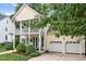 Charming two-story home with double front porch and attached two-car garage at 10415 Ashmead Ln, Raleigh, NC 27614