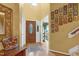 Bright foyer with hardwood floors, decorative wall art, and a charming wooden table at 10415 Ashmead Ln, Raleigh, NC 27614