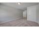 Neutral bedroom featuring carpet flooring, and a white door at 1062 Beacon Hill Rd # 45, Lillington, NC 27546