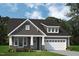 Charming home with stone accents, a grey roof, and a two-car garage at 1062 Beacon Hill Rd # 45, Lillington, NC 27546