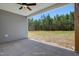 Covered patio with natural views of wooded backyard at 1062 Beacon Hill Rd # 45, Lillington, NC 27546