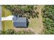 Aerial view of home showcases a wooded lot, deck, and ample outdoor space, blending privacy with nature's beauty at 108 Rocking Horse Ln, Sanford, NC 27332