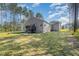 Spacious backyard with a deck, mature trees and grass at 108 Rocking Horse Ln, Sanford, NC 27332