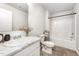 Bathroom with a modern vanity, a large mirror, and a bathtub with shower, all designed for relaxation and convenience at 108 Rocking Horse Ln, Sanford, NC 27332