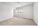 Neutral bedroom featuring plush carpet, natural light, and ample space to accommodate a variety of decor and furniture styles at 108 Rocking Horse Ln, Sanford, NC 27332