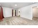Spacious bedroom with neutral carpet, window with curtains, and ensuite bathroom at 108 Rocking Horse Ln, Sanford, NC 27332