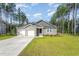 Beautiful home featuring a manicured lawn, a two-car garage, and a cozy porch perfect for relaxing at 108 Rocking Horse Ln, Sanford, NC 27332