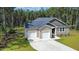 Charming single-story residence with a two-car garage, well-maintained lawn, and inviting front entrance in a serene setting at 108 Rocking Horse Ln, Sanford, NC 27332