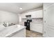 This kitchen boasts marble countertops, bright white cabinetry, and modern appliances offering a blend of style and functionality at 108 Rocking Horse Ln, Sanford, NC 27332
