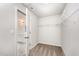 Walk-in closet with carpeted floors and wire shelving with connected bathroom at 108 Rocking Horse Ln, Sanford, NC 27332