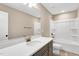 Bathroom with a large mirror over the sink and a shower/tub combination with white tub at 1119 Brookfield Dr, Gibsonville, NC 27249