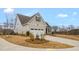 Well-maintained home featuring a covered porch and a two-car garage at 1119 Brookfield Dr, Gibsonville, NC 27249