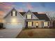 Charming home featuring a covered porch and a two-car garage at 1119 Brookfield Dr, Gibsonville, NC 27249
