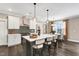 Modern kitchen with breakfast bar, stainless steel appliances, and an adjacent dining area at 1119 Brookfield Dr, Gibsonville, NC 27249
