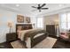 Main bedroom features wood floors, tray ceiling, accent wall, and lots of natural light at 1119 Brookfield Dr, Gibsonville, NC 27249