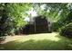 A beautiful backyard showcasing a two-story deck, and abundant trees for privacy and shade at 116 Trinity Woods Dr, Raleigh, NC 27607