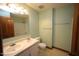 Bathroom with double sink vanity, toilet, tub, and mint green walls at 116 Trinity Woods Dr, Raleigh, NC 27607