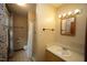 Clean bathroom featuring a shower, vanity, and patterned floor tiles at 116 Trinity Woods Dr, Raleigh, NC 27607