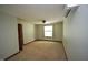Neutral bedroom with light-colored carpet and light-colored walls at 116 Trinity Woods Dr, Raleigh, NC 27607