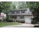 Beautifully maintained two-story home with a single-car garage and mature landscaping at 116 Trinity Woods Dr, Raleigh, NC 27607