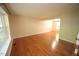 Spacious living room featuring gleaming hardwood floors and natural light at 116 Trinity Woods Dr, Raleigh, NC 27607