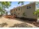 A spacious backyard featuring a wooden deck, and mature landscaping at 1210 Eastham Dr, Apex, NC 27502