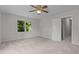 Bright bedroom with neutral carpet, closet and a window, offering a serene and functional living space at 1210 Eastham Dr, Apex, NC 27502