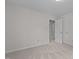 Spacious bedroom with neutral carpet, and ample closet space, offering a blank canvas for personalization at 1210 Eastham Dr, Apex, NC 27502