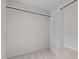 Walk-in closet with built-in shelving and wooden hanging rods at 1210 Eastham Dr, Apex, NC 27502