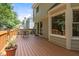 A deck with chairs overlooks manicured landscaping and the home's rear facade at 1210 Eastham Dr, Apex, NC 27502