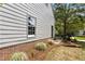 The exterior features neutral siding complemented by well-maintained landscaping and mature shrubbery at 1210 Eastham Dr, Apex, NC 27502