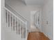 Inviting foyer with hardwood floors, a staircase leading to the upper level, and an entry to a sun-filled room at 1210 Eastham Dr, Apex, NC 27502