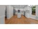 Spacious kitchen with white cabinets, stainless steel appliances and a kitchen island at 1210 Eastham Dr, Apex, NC 27502
