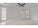 Open main bedroom featuring a ceiling fan and multiple closets at 1210 Eastham Dr, Apex, NC 27502