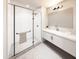 Modern bathroom with a glass-enclosed shower, marble vanity, sleek fixtures, and minimalist design at 130 Two Hills Dr # 104B, Carrboro, NC 27510