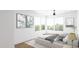 Bright bedroom featuring a cozy queen bed, modern decor, and large windows offering ample natural light at 130 Two Hills Dr # 104B, Carrboro, NC 27510