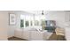 Open-concept living area with large windows, modern furnishings, and hardwood floors at 130 Two Hills Dr # 104B, Carrboro, NC 27510