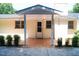 Cozy back porch with brick exterior and a covered entrance, offering a private outdoor space at 1307 Sycamore Dr, Garner, NC 27529